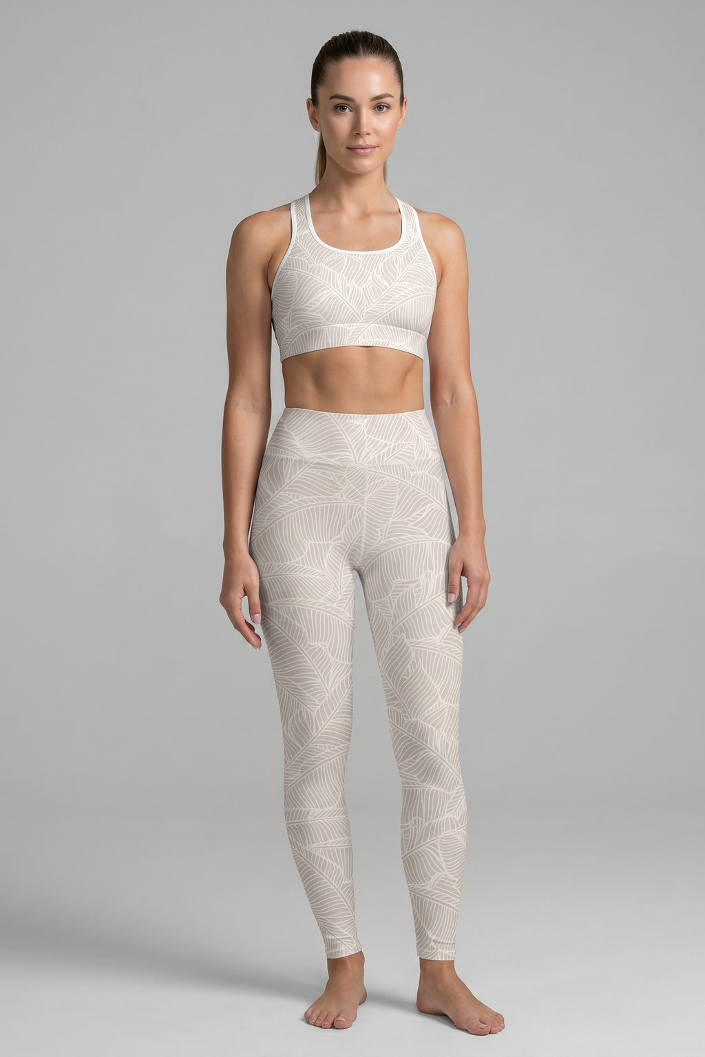 Woman wearing a white patterned athletic outfit on a gray background